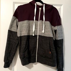 Zip up hoodie with 3 colors, size extra large.